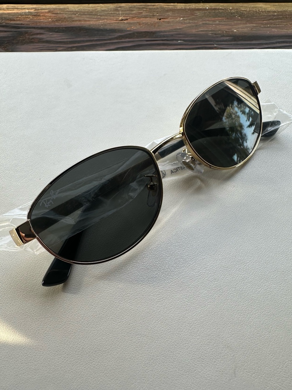 Ray-Ban Women’s Round Sunglasses in Gold Frame with Dark Lenses